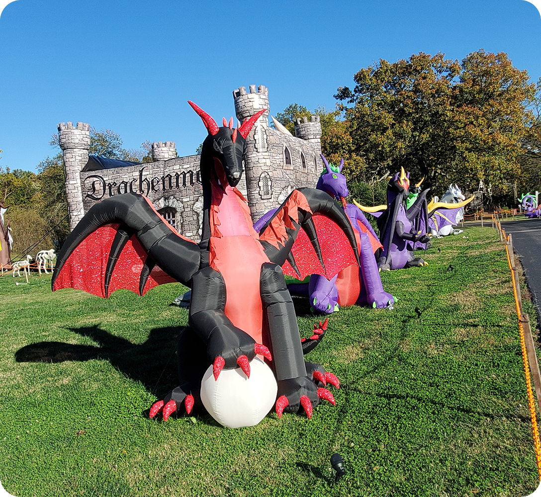 Inflatable dragons in front of a castle.